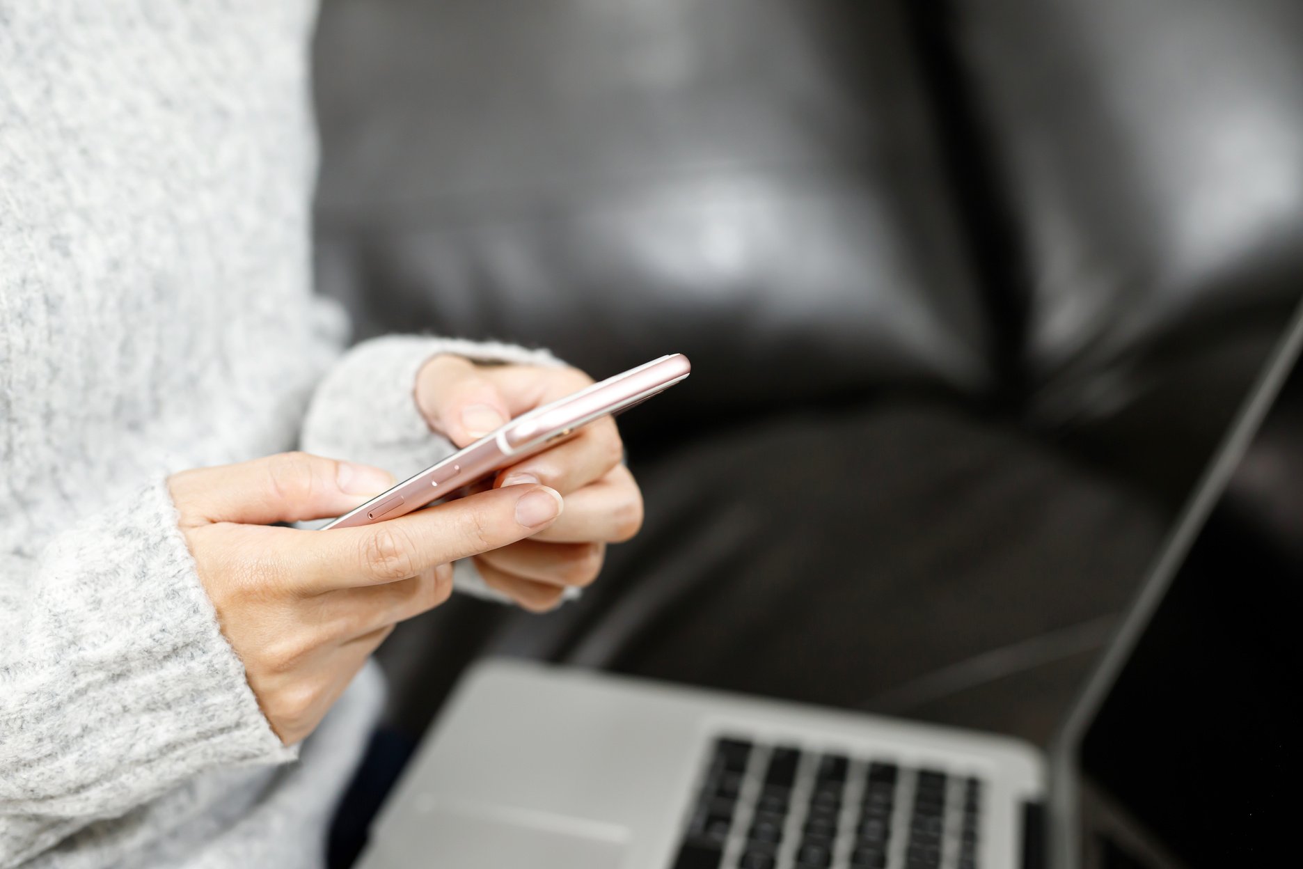 Woman Using Phone Indoors